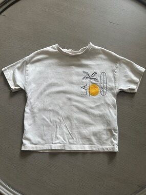 Zara White Tee with Yellow Sun and Surf Graphic